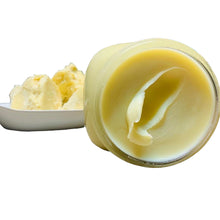 Load image into Gallery viewer, Opened bottle of shea butter with a stack of shea butter in the background
